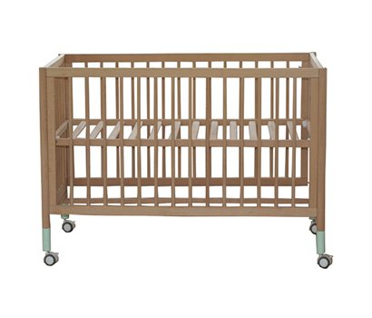 Baby cot with green leg